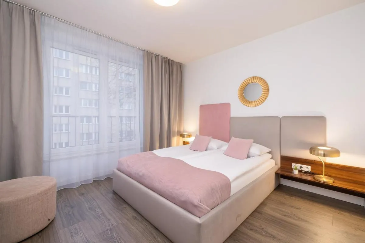 Image 1 of Blue and Green Apartment with Bright Pink Bedroom in Kraków by Noclegi Renters